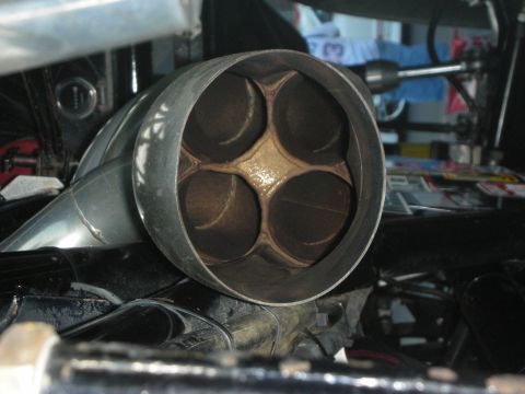 1998 Ford Crown Victoria - Exhaust pipe outlet with four internal chambers visible.