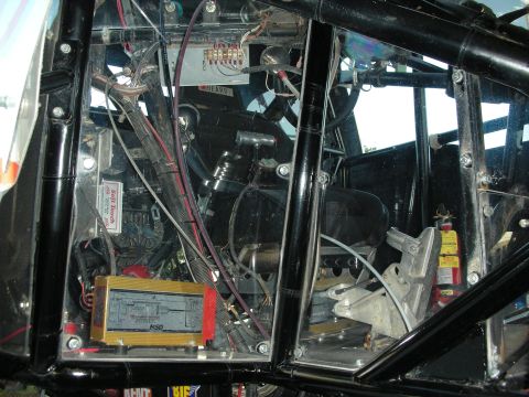 1998 Ford Crown Victoria - The complex wiring and components inside a custom-built race car are visible.