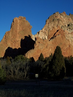 1972 Ford Ranchero - A landscape scene prominent rock formations and evergreen trees under a bright blue sky.