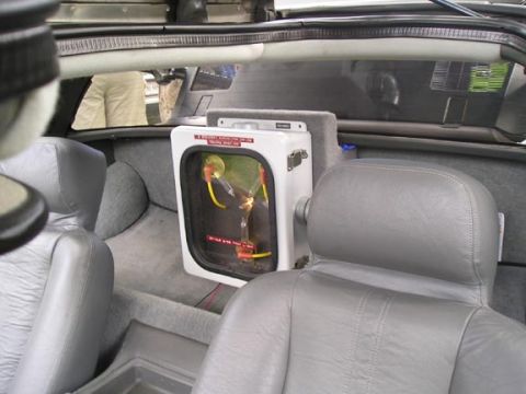1984 Pontiac Fiero - The iconic flux capacitor is visible inside the car's interior.