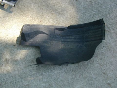 2000 Ford Taurus - Take this fender cover off the front of the wheel well.