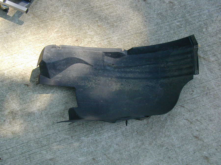 Take this fender cover off the front of the wheel well.