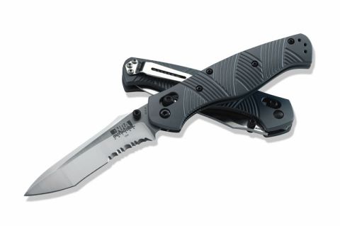 2001 Ford Crown Victoria - A gray folding knife with a serrated blade, NRA Outdoors branding on the blade and a textured handle.