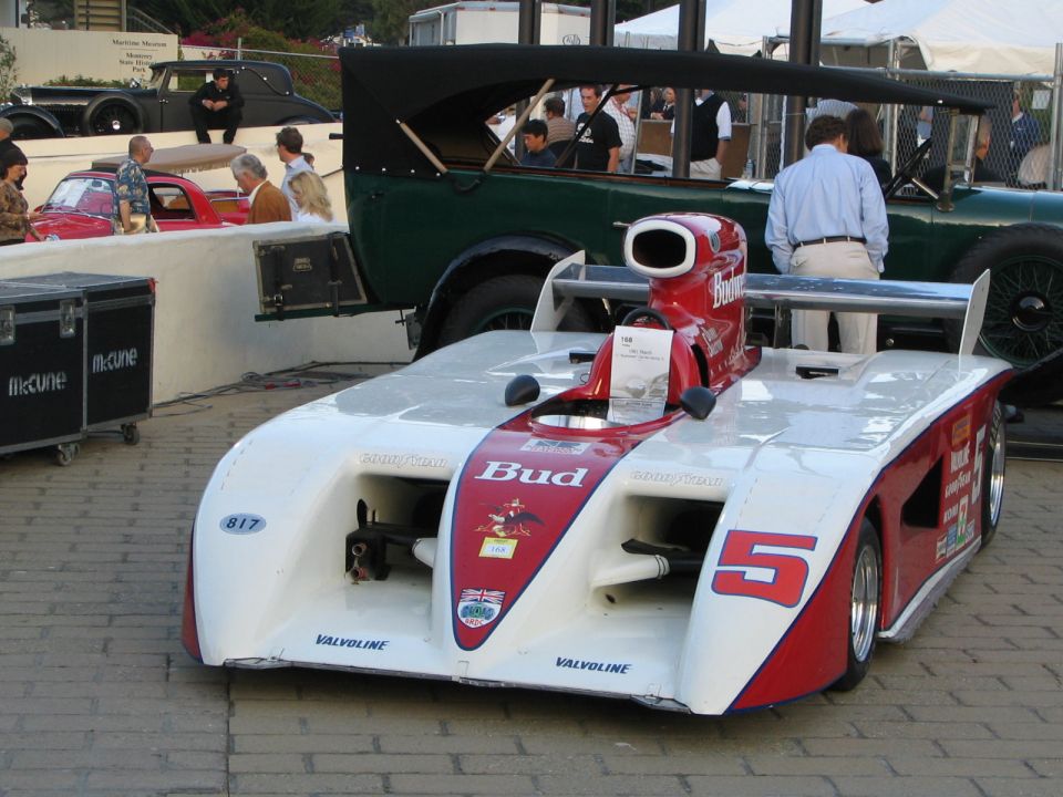 White and red racing car with number 5, Budweiser sponsorship, and air intake