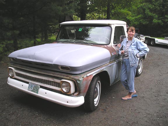 1960 Chevrolet C10 pickup truck, primer hood, white bumper, license plate 218-2252
