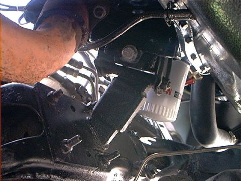 1978 Ford Bronco - Close-up view of engine components, including an oil filter and hoses, with some readable text visible.