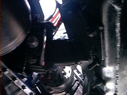 1978 Ford Bronco - Detail shot of engine bay components, focus on mechanical parts and structure.