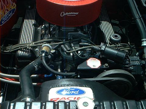 1978 Ford Bronco - Close-up view of a Ford V8 engine, showing the air filter and racing decals.