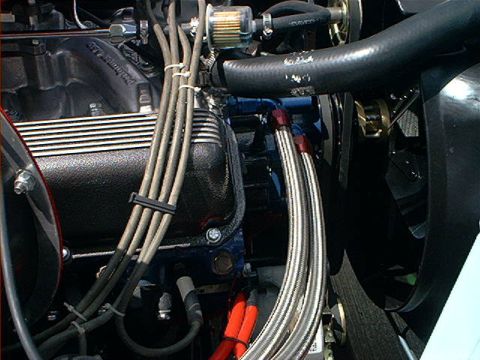 1978 Ford Bronco - Close-up of an engine bay, focusing on the fuel filter and wiring.