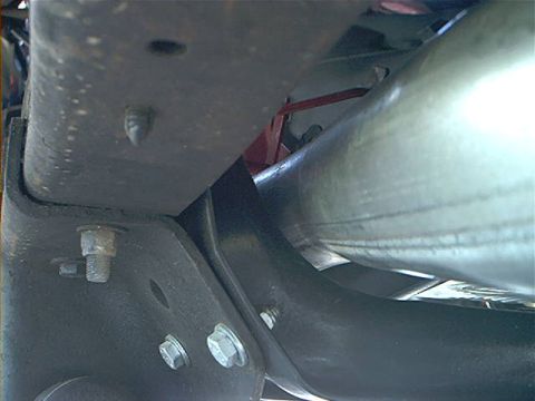 1978 Ford Bronco - Close-up of the undercarriage reveals the exhaust system and frame structure, with no clear year-identifying features visible.