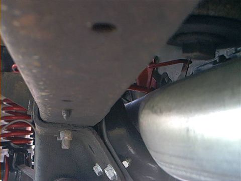 1978 Ford Bronco - Underside view of vehicle components including suspension and exhaust system parts.