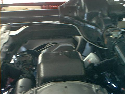 1978 Ford Bronco - Close-up view of the engine compartment, showing various mechanical parts and hoses.