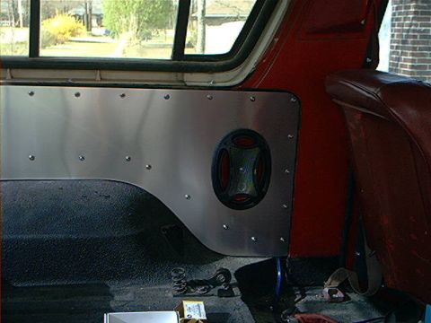 1978 Ford Bronco - Interior panel with riveted aluminum and a black circular vent is visible.