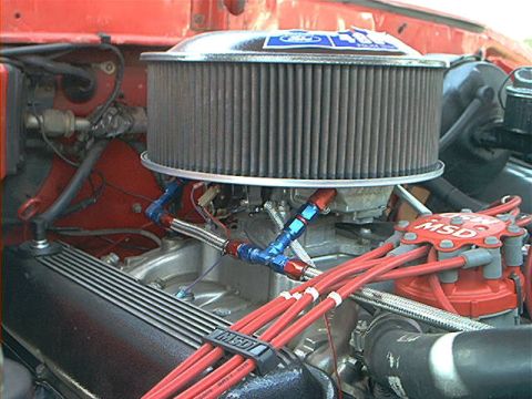 1978 Ford Bronco - Close-up view of an engine bay, showing performance parts like an MSD ignition and custom fuel lines.