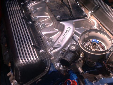 1978 Ford Bronco - Close-up of a polished engine component, likely a Ford 460 V8, with aftermarket parts visible.