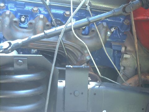 1978 Ford Bronco - Engine bay detail with blue painted engine block and exhaust components visible.
