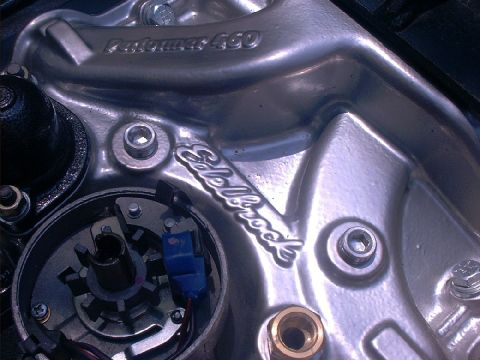 1978 Ford Bronco - This is a close-up view of an engine part, specifically an Edelbrock intake manifold and distributor assembly.