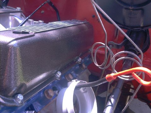 1978 Ford Bronco - A detailed view of engine parts, focusing on the valve cover and surrounding wiring.