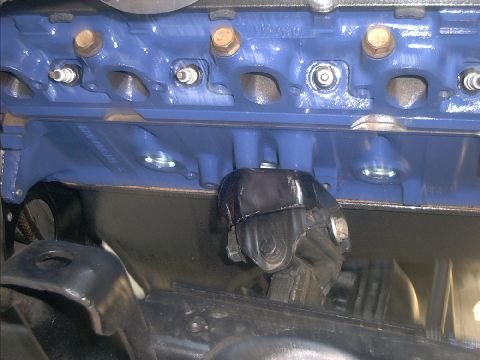 1978 Ford Bronco - Close-up view of an engine motor mount connected to the engine block.