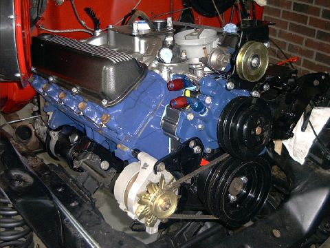 1978 Ford Bronco - The engine bay shows a rebuilt V8 motor with custom blue paint and polished components.