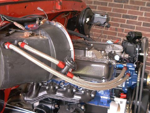 1978 Ford Bronco - Close-up view of an engine bay, highlighting braided hoses and V8 engine parts.