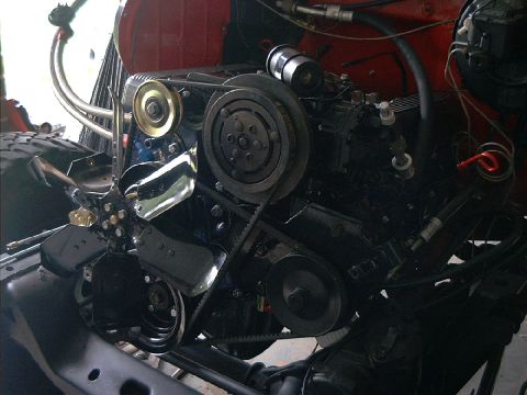 1978 Ford Bronco - Engine bay detail with V-belts and fan visible.