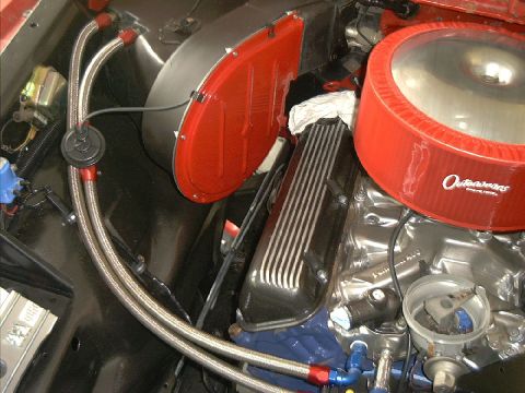 1978 Ford Bronco - Custom engine bay modifications include braided hoses and a prominent air cleaner assembly.