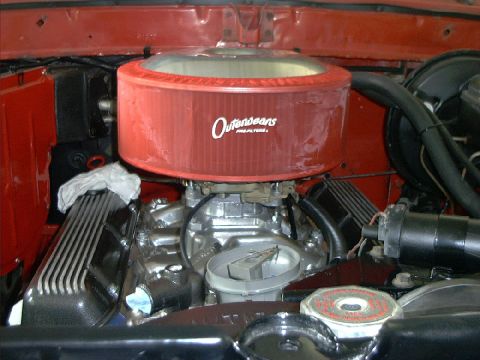 1978 Ford Bronco - The engine bay features a prominent red air filter and chrome valve covers, suggesting aftermarket modifications.