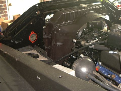 1978 Ford Bronco - Close-up of the engine bay, focusing on the radiator and brake booster assembly.