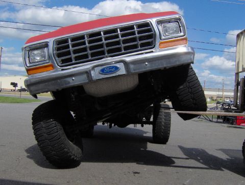1978 Ford Bronco - Front view of a 1979 Ford F-Series truck with its front end lifted.