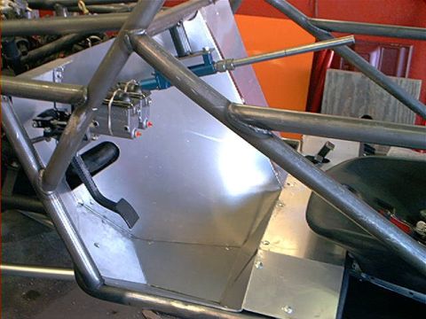 1978 Ford Bronco - Close-up of a custom roll cage and brake system, likely for a modified vehicle.