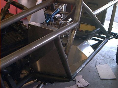1978 Ford Bronco - The intricate roll cage and exposed engine components suggest a custom-built off-road vehicle, not a stock 1978 Ford Bronco.