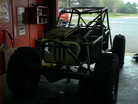 1978 Ford Bronco - This custom-built buggy is in a garage, likely undergoing modifications or repairs.