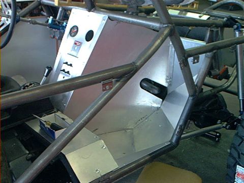 1978 Ford Bronco - The interior of a custom-built vehicle features a complex roll cage and a fabricated dashboard with various controls.