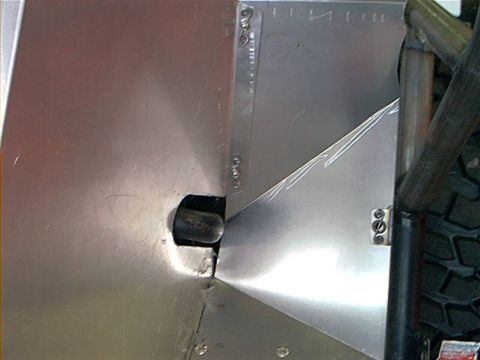 1978 Ford Bronco - This image shows custom metal fabrication, likely for an off-road vehicle project, with a tire and roll cage visible.
