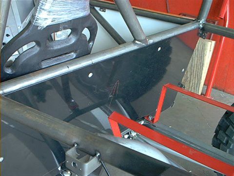 1978 Ford Bronco - Interior view of a custom-built rockcrawler, a prominent roll cage and a large, dark-colored component.