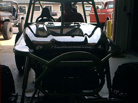 1978 Ford Bronco - A custom buggy with a roll cage and "Performance Powdercoating" text is seen in a garage with other vehicles.