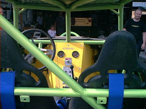 1978 Ford Bronco - Custom buggy interior shows racing seats, roll cage, and dashboard with gauges.