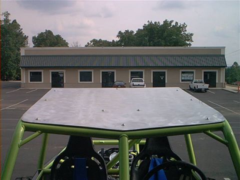 1978 Ford Bronco - The interior of a custom-built off-road buggy is shown, with a metal roof and racing seats visible.
