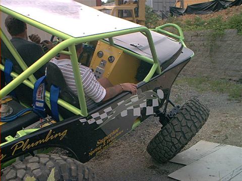 1978 Ford Bronco - Custom off-road buggy with two occupants, modified for rough terrain.