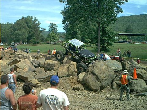 1978 Ford Bronco - A custom-built off-road vehicle navigates a challenging rock obstacle course.
