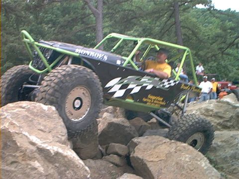 1978 Ford Bronco - Custom buggy with roll cage tackles a rocky obstacle course.