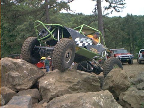 1978 Ford Bronco - A custom-built buggy navigates a rocky obstacle course with other vehicles nearby.