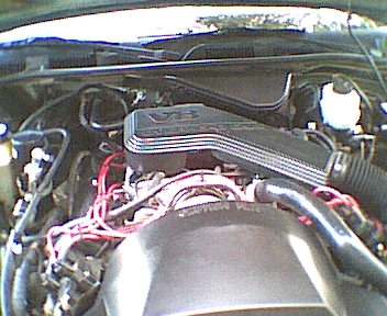 1994 Ford Crown Victoria - Engine bay of a 1994 Ford Crown Victoria, showing the V8 engine components.