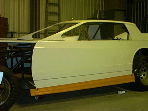 1978 Ford Bronco - A custom car body is under construction, showing its unique design and roll cage structure.