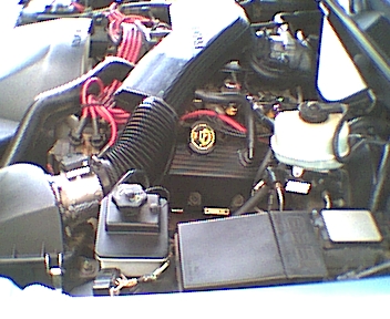 1994 Ford Crown Victoria - Close-up view of a vehicle's engine bay, showing various components and wiring.