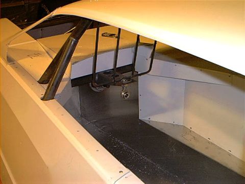 1978 Ford Bronco - Vehicle interior with roll cage structure and bare metal panels, likely a project car.
