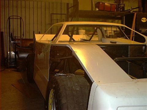 1978 Ford Bronco - This is a custom-built race car chassis, not a 1978 Ford Bronco, undergoing construction in a garage.