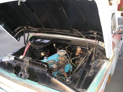 1984 Pontiac Fiero - Classic truck engine bay with hood open, showing the blue engine block and various components.