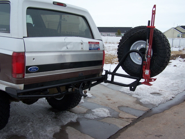 1991 Ford Bronco rear bumper with swing-away spare tire carrier and Hi-Lift jack mounted